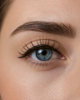 Magnetic eyelashes blended on blue eye, dark lashes with defined outer corner