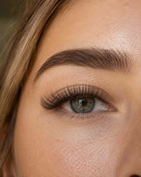 Close-up of an eye with long 3D false eyelashes applied