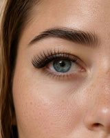 False eyelashes enhancing model eye, long curled lashes over upper lid