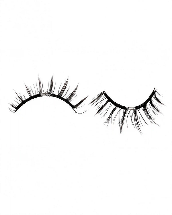 Pair of black magnetic fake lashes with curved band and tapered lash fibers