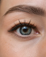 Close-up of eye wearing black magnetic fake lashes along the upper lash line