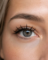 Close-up of eye with long black magnetic eyelashes