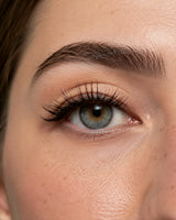 Close-up of eye with long curved black false eyelashes
